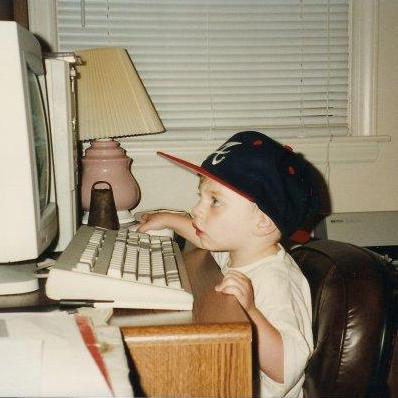 John Williams as a baby, working on a computer